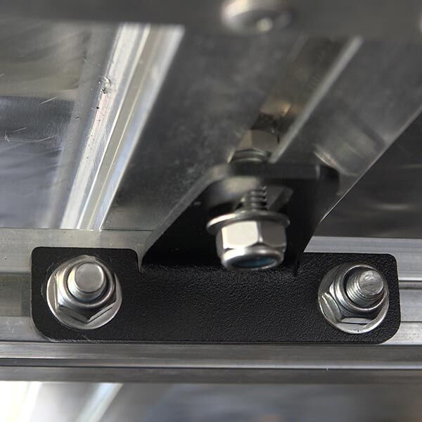 Flush mount bracket bolted inside a roof rail channel