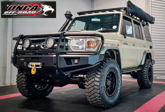ONCA RFX-LD bull bar with LED lights on a sandy taupe Land Cruiser 76