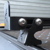 Close-up of a High Foot Mount bolted to a rooftop tent's Ezi-Slot rail