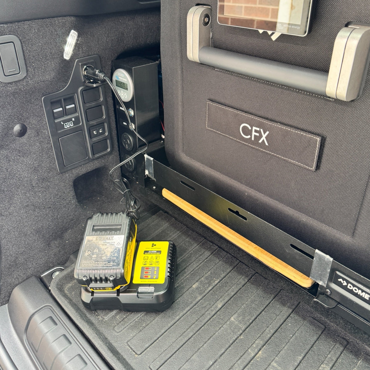 DeWalt-compatible Balanced Auto Charger: mounted in a vehicle's rear cargo area