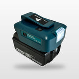 Makita-compatible USB & 12V Charger with LED Light: on an 18V battery, angled view