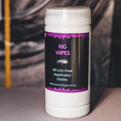 Container of Rig Wipes with a visible brand label on a blurred background