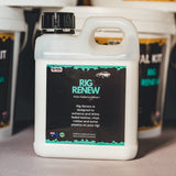 Container of Rig Renew with a label on a surface, surrounded by similar containers.