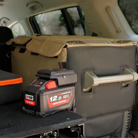 Milwaukee-compatible 18V to 12V Step Down Power Supply: in use on a battery in the back of a vehicle